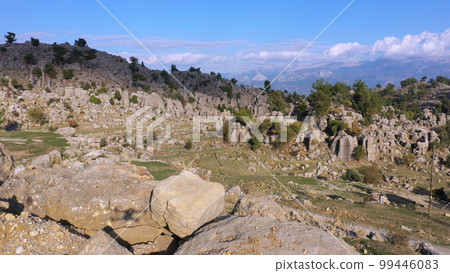 Mountain valley landscape and rock formations. Aerial view from drone. Nature scene. 99446083