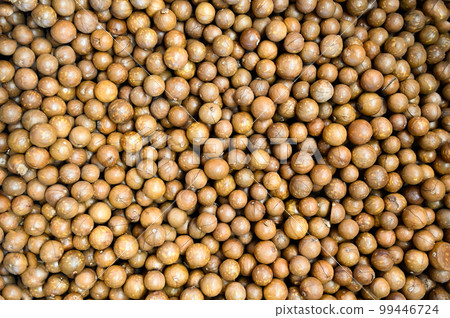 macadamia nuts texture background, fresh natural shelled raw macadamia nuts in a full frame, close up pile of roasted macadamia nut - top view 99446724