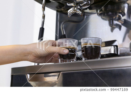 barista brewing, preparing coffee in cafe 99447189