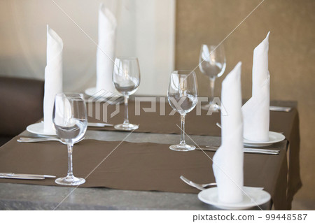 Table in a restaurant with empty glasses and plates. Table in a restaurant with empty glasses and plates. 99448587