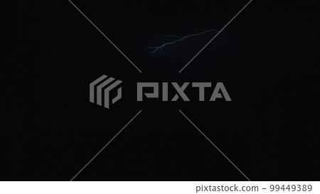 Lightning in the night sky over the city, a bright flash in the clouds during a thunderstorm. Lightning in the night sky. Lightning in the night sky over the city, a bright flash in the clouds during a thunderstorm. Lightning in the night sky. 99449389