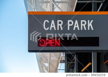 Car Park Open sign installed on building facade Car Park Open sign installed on building facade 99450259
