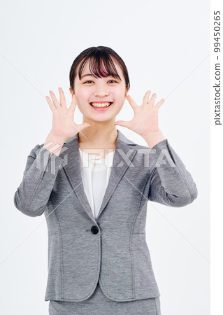 Young woman in a suit smiling 99450265