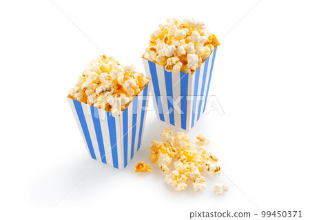 Two blue white striped carton buckets with tasty cheese popcorn, isolated on white background Two blue white striped carton buckets with tasty cheese popcorn, isolated on white background 99450371