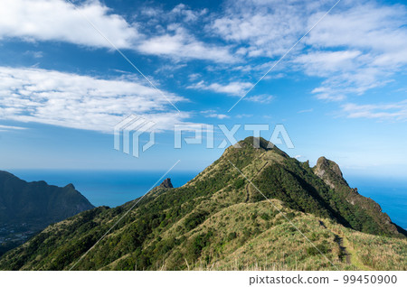 Spring mountain landscape. People feel comfortable, free and at peace. 99450900