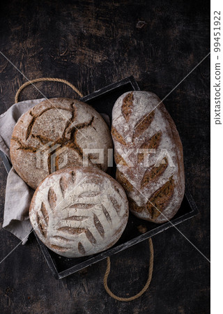 Fresh homemade bread with a crispy crust Fresh homemade bread with a crispy crust 99451922