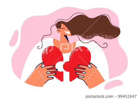 Happy girl holding heart puzzle and smiling broadly pimping loving people or arranging romantic date Happy girl holding heart puzzle and smiling broadly pimping loving people or arranging romantic date 99452047