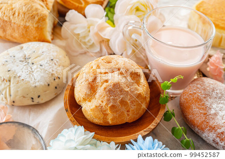 Assorted cream puffs and bread 99452587