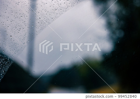 Driving in the rain, wet windshield 99452840