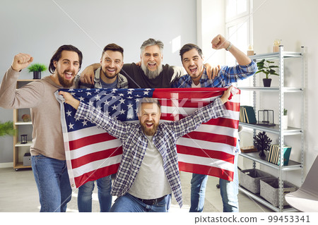 Happy father and sons with American flag celebrating US Independence Day together Happy father and sons with American flag celebrating US Independence Day together 99453341