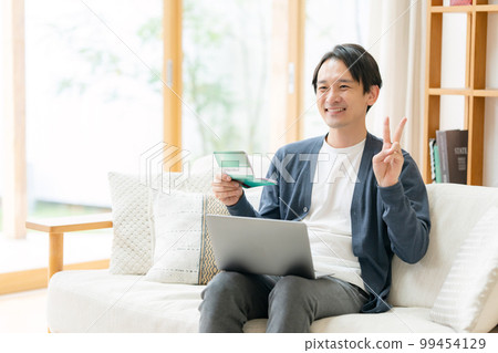 A man who is happy to see passbooks 99454129