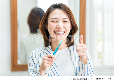 Dental care tooth brushing thumbs up Dental care tooth brushing thumbs up 99454976