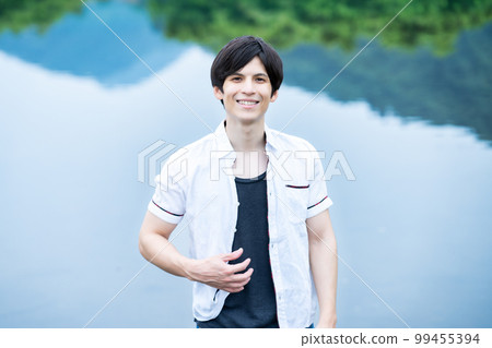 Half man having fun at the waterside Half man having fun at the waterside 99455394