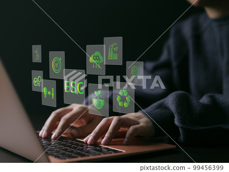 ESG environmental social governance investment business concept. woman uses a computer to analyze ESG data. ESG icons pop up on virtual screen in business sustainability investment strategy concept. 99456399
