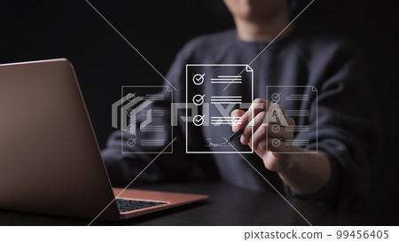 E-document management Paperless workplace. Online business contract Electronic signature concept. e-signing, businesswoman signs an electronic document on virtual screen using a pen. 99456405