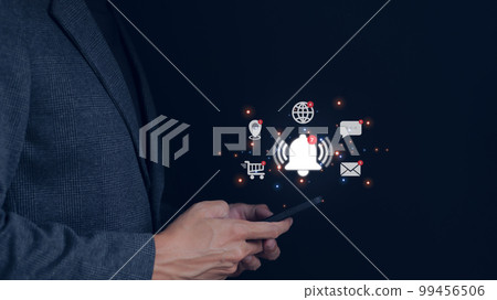 Businessman using smartphone with virtual bell ringing for application notification alert concept. social media and internet network, email, telephone, chat, shopping online, map location, Businessman using smartphone with virtual bell ringing for application notification alert concept. social media and internet network, email, telephone, chat, shopping online, map location, 99456506