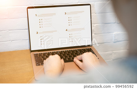 Woman passing online exam, Questionnaire online with checkboxes, Evaluation, Online survey online exam Choosing the right answer in the exam, Test questions. Filling out online survey form business. 99456592