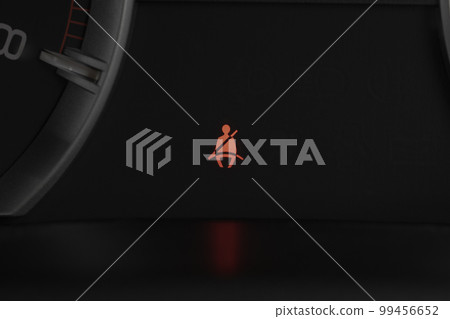 Seat belt warning light on car dashboard. Safety restraint law, safety concept. 99456652