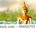Makha Asanaha Visakha Bucha Day Golden Buddha image. Background of Bodhi leaves with shining light. Soft image and smooth focus style 99456755