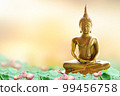 Makha Asanaha Visakha Bucha Day Golden Buddha image. Background of Bodhi leaves with shining light. Soft image and smooth focus style 99456758