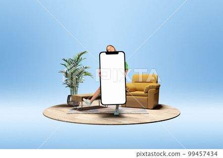 Happy smiling young girl holding giant 3D model of mobile phone with empty screen for text, ad. Online shopping. Mockup for design, logo. Happy smiling young girl holding giant 3D model of mobile phone with empty screen for text, ad. Online shopping. Mockup for design, logo. 99457434