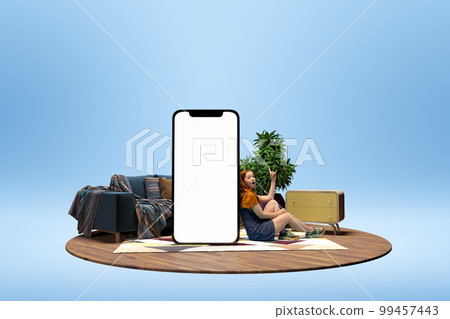 Young excited girl sitting near giant 3D model of phone screen with empty space for text, ad. Online shopping, delivery. Mockup for design, logo. Young excited girl sitting near giant 3D model of phone screen with empty space for text, ad. Online shopping, delivery. Mockup for design, logo. 99457443