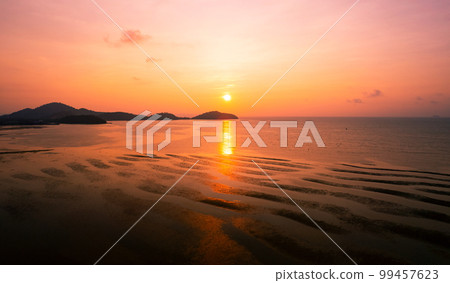 Aerial view sunset sky, Nature beautiful Light Sunset or sunrise over dark sea, Colorful dramatic majestic scenery Sky with Amazing clouds and waves in sunset sky nature light cloud background Aerial view sunset sky, Nature beautiful Light Sunset or sunrise over dark sea, Colorful dramatic majestic scenery Sky with Amazing clouds and waves in sunset sky nature light cloud background 99457623