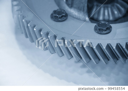Close-up scene of transmission  gear spare parts in the light blue scene with lighting effect. 99458554