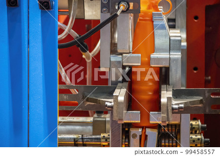 The orange bottle container manufacturing process by blow mold machine. The orange bottle container manufacturing process by blow mold machine. 99458557