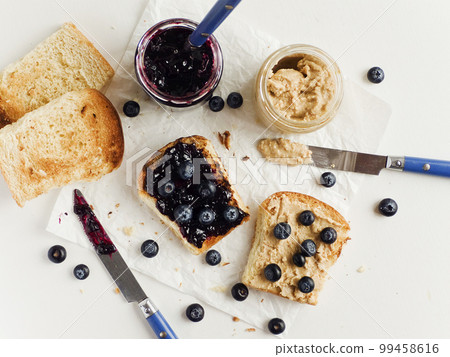 Peanut butter blueberry jam toasts 99458616