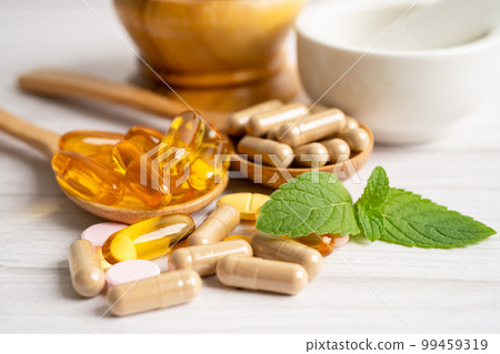 Alternative medicine herbal organic capsule with vitamin E omega 3 fish oil, mineral, drug with herbs leaf natural supplements for healthy good life. 99459319
