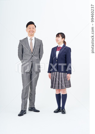A man in a suit and a high school girl 99460237