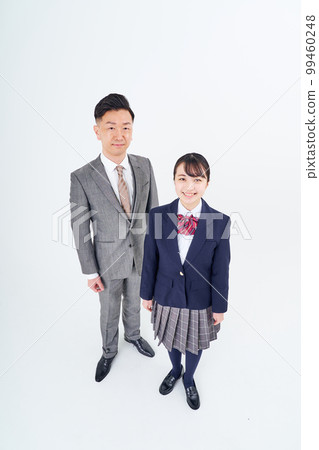 A man in a suit and a high school girl 99460248