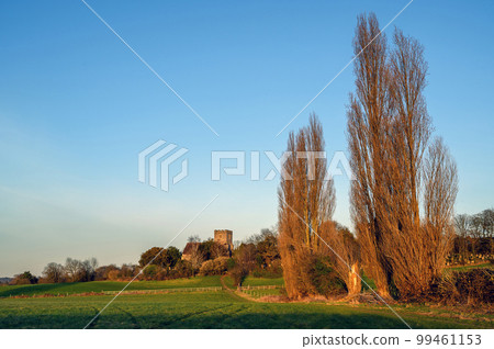 Church in the English countryside with field and trees. Late afternoon just before sunset. St John's Church, West Wickham, Kent, UK. 99461153