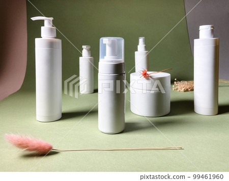 various white blank bottles and twigs of plants various white blank bottles and twigs of plants 99461960