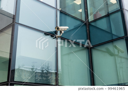 outdoor security camera on green glass wall outdoor security camera on green glass wall 99461965