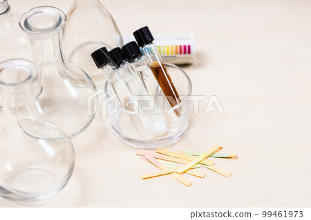 test tubes with solutions, flasks and indicators 99461973