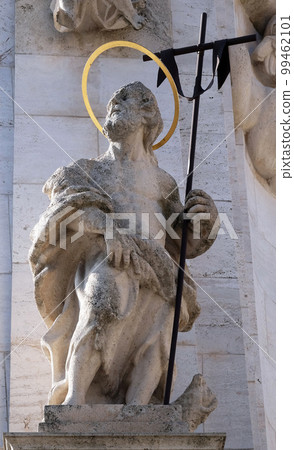 Statue of Saint John the Baptist, detail of Holy Trinity plague column in front of Matthias Church in Budapest, Hungary 99462101