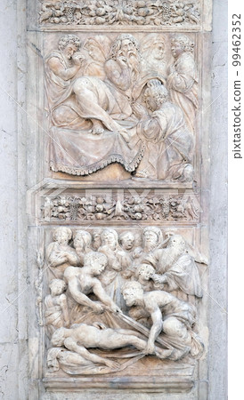 Isaac blesses Jacob by Ercole Seccadenari up and Burial of Jacob's wife by Amico Aspertini, left door of San Petronio Basilica in Bologna, Italy 99462352