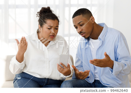 Young couple have online meeting with therapist, using phone 99462640