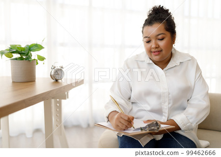Chubby young mixed race lady counselor working at office 99462666