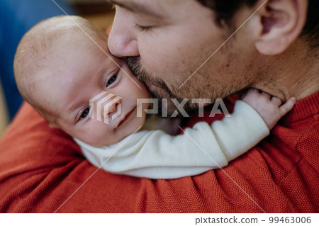 Close-up of father kissing his little son. Close-up of father kissing his little son. 99463006