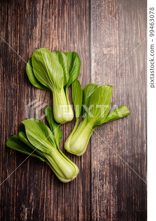 Celery cabbage or peach choi, asian baby salad leaves on wooden background Celery cabbage or peach choi, asian baby salad leaves on wooden background 99463078
