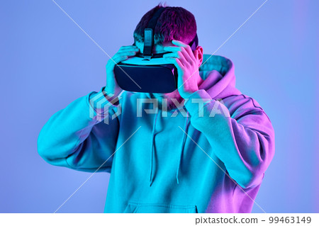 man using virtual reality glasses and playing video games man using virtual reality glasses and playing video games 99463149