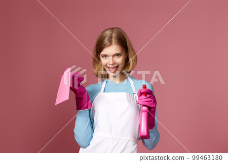 woman in cleaner apron wieaning rag and detergent sprayer 99463180