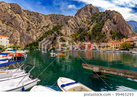 Croatia, City of Omis, a popular tourist destination for trekking and rafting on the Cetina river. Mountains, river, pleasure boats. Croatia, City of Omis, a popular tourist destination for trekking and rafting on the Cetina river. Mountains, river, pleasure boats. 99463293