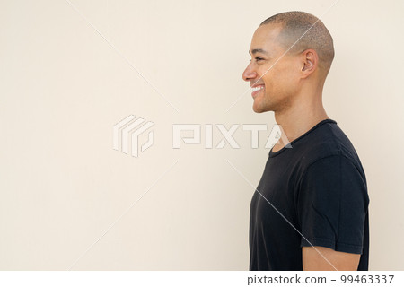 Profile view portrait of handsome bald man wearing t-shirt Profile view portrait of handsome bald man wearing t-shirt 99463337