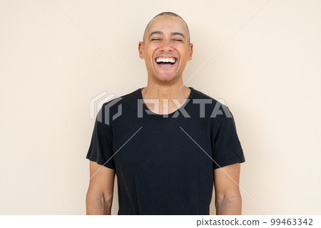 Portrait of handsome bald man laughing 99463342