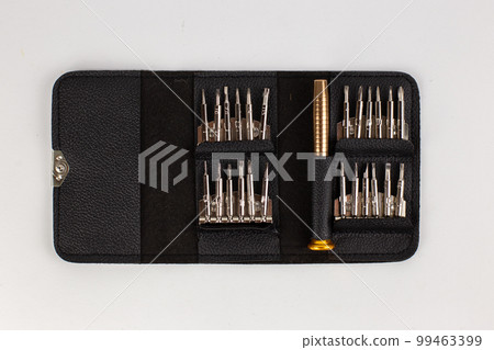 a set of screwdrivers in a leather case on a white background 99463399