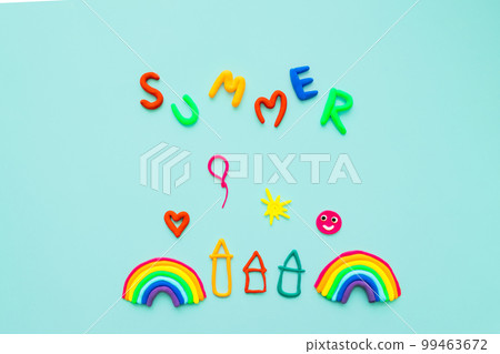 volumetric figures from colored plasticine: inscription summer, rainbow, houses, balls, sun in children's style on blue background volumetric figures from colored plasticine: inscription summer, rainbow, houses, balls, sun in children's style on blue background 99463672